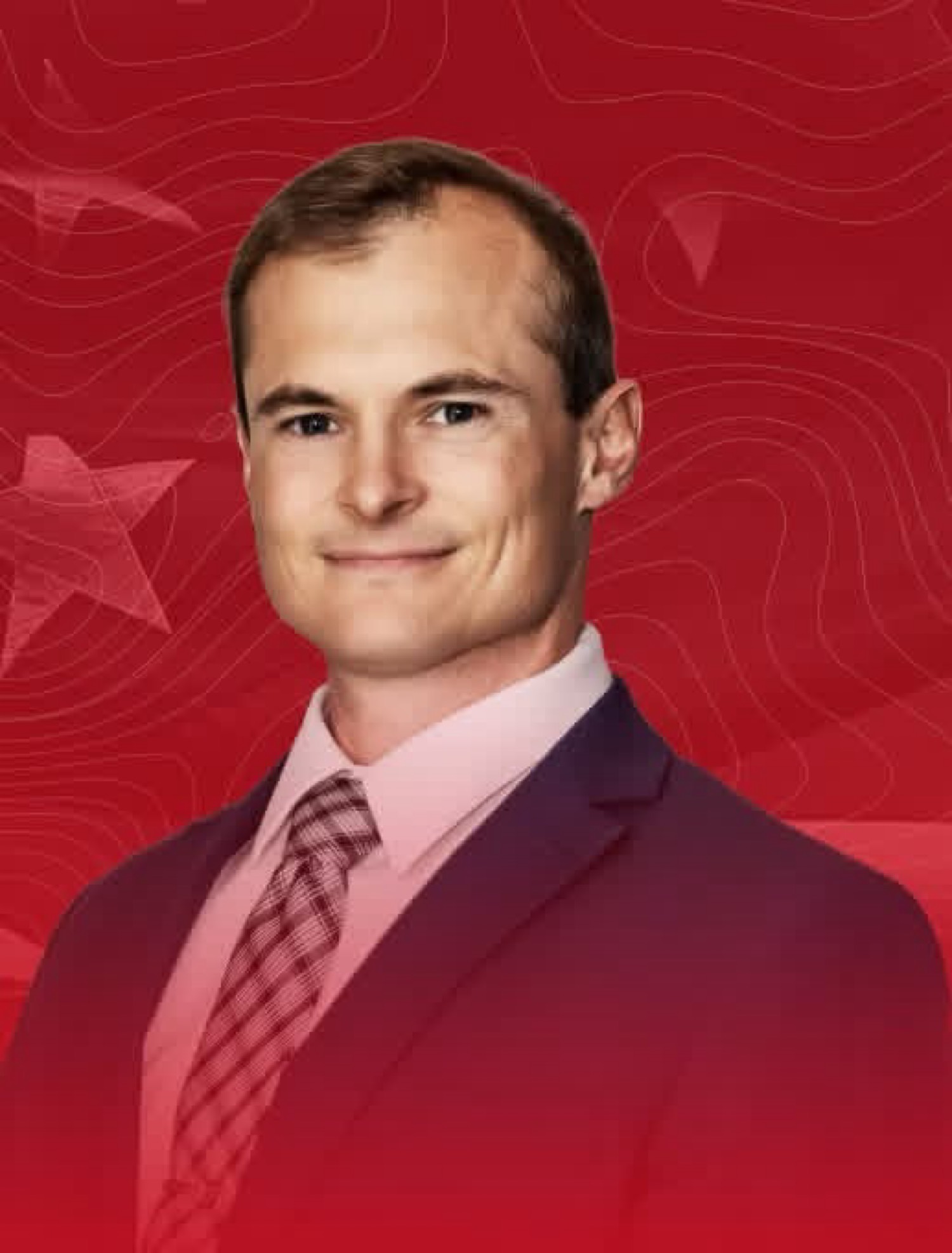 Cory Thornton, candidate for North Carolina House, in a navy suit against a red campaign backdrop